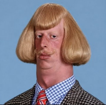 A man with a distinctive blonde bowl-cut hairstyle and matching mustache wears a checkered shirt and patterned blazer against a blue background, serving as the visual representation of the "Jean Phil" meme token being promoted. The quirky, eccentric appearance of the character reinforces the humorous branding of the $JEANPHIL token now available for trading on Pumpfun.