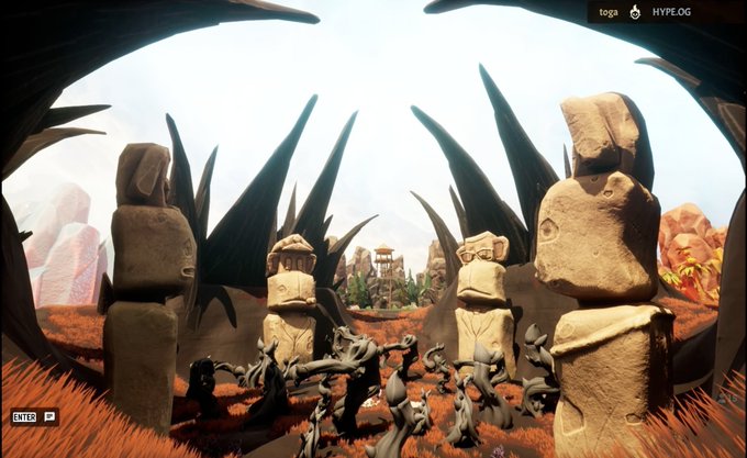 A first-person screenshot from a 3D video game (labeled 'toga' and 'HYPE.OG') showing dark alien-like creatures gathered among stone Moai-like statues and sharp spiky plants in a desert landscape.