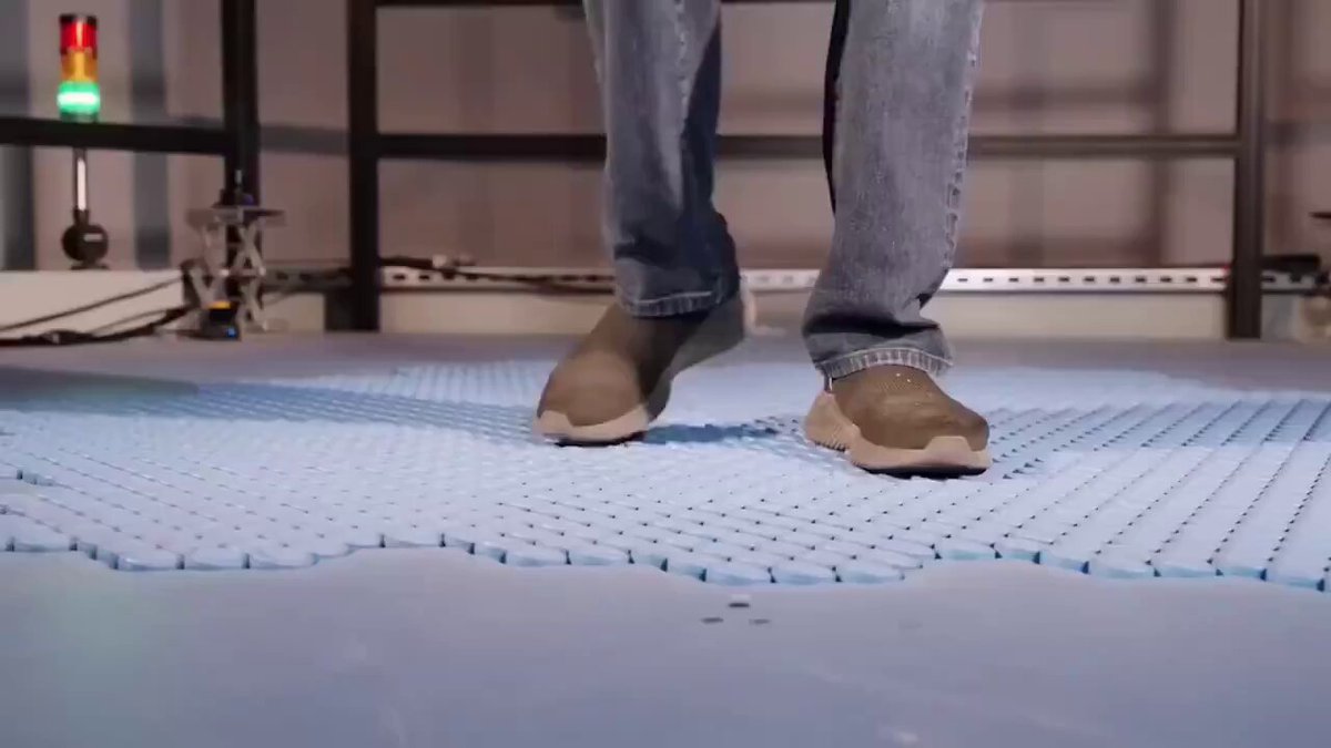 The image shows a person wearing brown shoes standing on a blue platform, possibly at an event or gathering. There are no visible texts or other objects in the image that provide context about the content of the post "Disney recreated Ethereum". The focus is primarily on the person and their footwear.