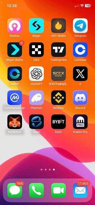 An iPhone home screen displaying various cryptocurrency and finance apps including StarKey, Bitget, HOT Wallet, Telegram, OKX, TradingView, Coinbase, Wallet, ChatGPT, SCEXTradingSimulator, X, CoinMarketCap, Phantom, Binance, Discord, MetaMask, Silush, Bybit, and Kraken Pro.