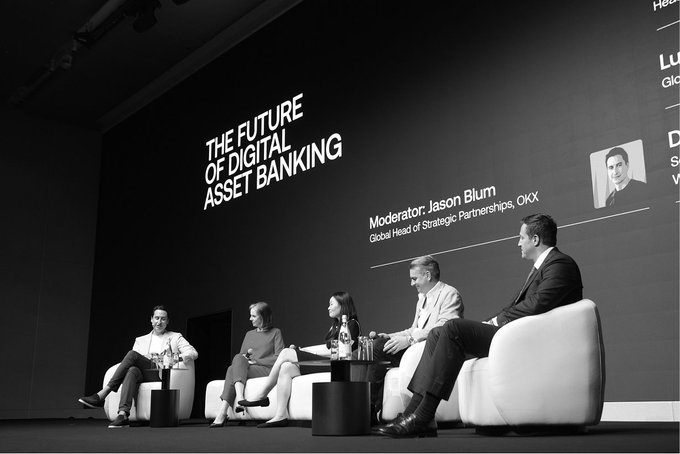 A panel of five industry leaders sits on a stage at a conference titled "THE FUTURE OF DIGITAL ASSET BANKING," moderated by Jason Blum, Global Head of Strategic Partnerships at OKX, with the discussion featuring representatives from DBS Bank, JPMorgan, Standard Chartered, and World Alliance Bank exploring how stablecoins, tokenization, and onchain finance are reshaping the banking industry's value creation.