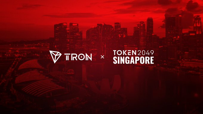 The image features a red-tinted Singapore skyline with the text "TRON × TOKEN2049 SINGAPORE," promoting TRON's presence at the TOKEN2049 Singapore conference, which ties into the post's emphasis on TRON's $60B+ stablecoin liquidity and its real-world economic significance.