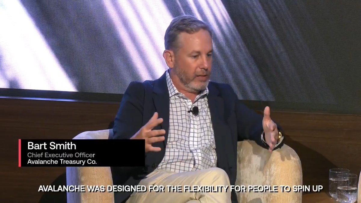 Bart Smith, Chief Executive Officer of Avalanche Treasury Co., sits in a chair gesturing with his hands during an interview, with a subtitle reading "AVALANCHE WAS DESIGNED FOR THE FLEXIBILITY FOR PEOPLE TO SPIN UP." The image accompanies the post highlighting how Avalanche enables businesses to create custom blockchains with their own compliance and KYC rules, driving real corporate adoption.