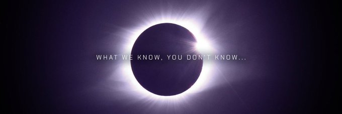 A total solar eclipse glows with a brilliant corona against a dark purple sky, overlaid with the text "WHAT WE KNOW, YOU DON'T KNOW..." The mysterious, cryptic caption pairs with the post's theme of hinting at deeper, unseen mechanics of the Moonclave ($MCV) system—suggesting there's more behind the project than typical hype-driven gamification.