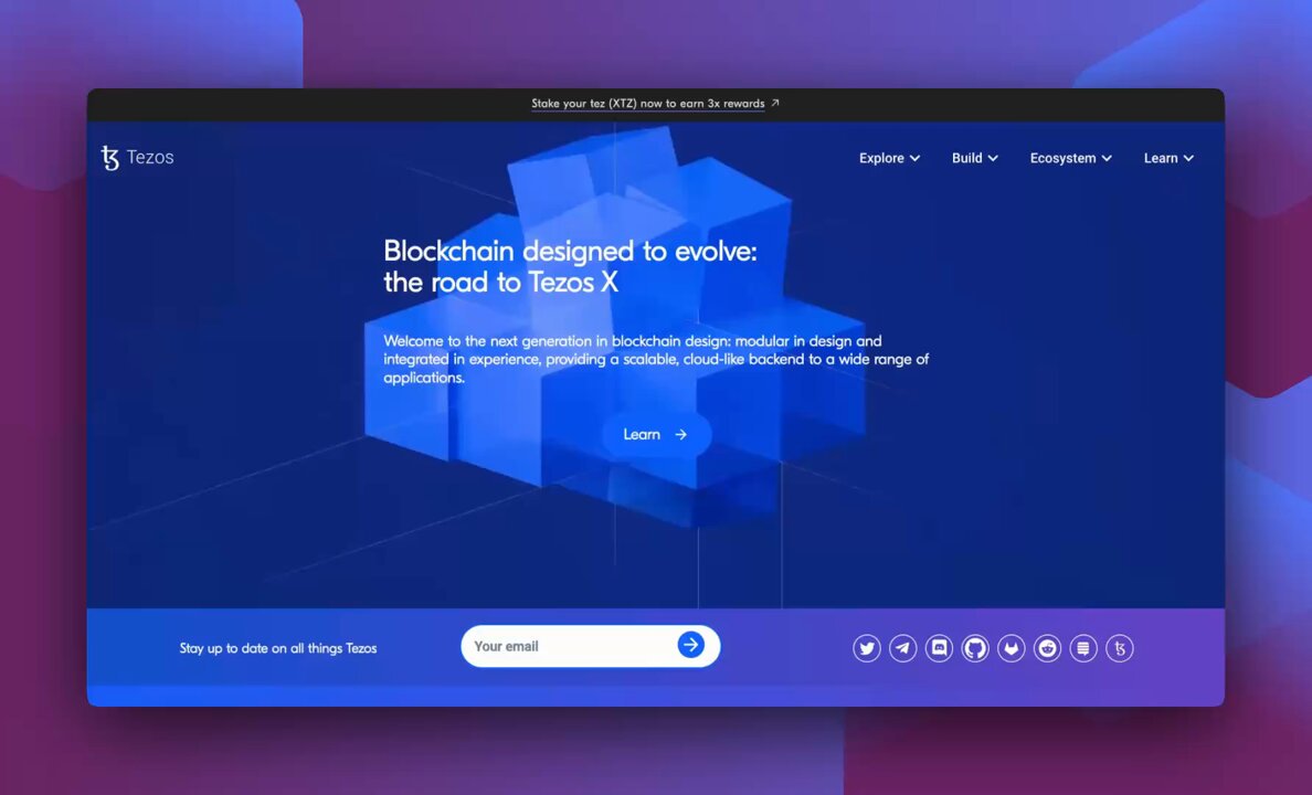 The image features a website called "tezos.com" with a blue background that displays a 3D rendering of blocks. The website appears to be related to blockchain technology or cryptocurrency, as indicated by the text at the top of the page. The main focus of the image is on the website itself, and there are no other objects or texts present in the scene.