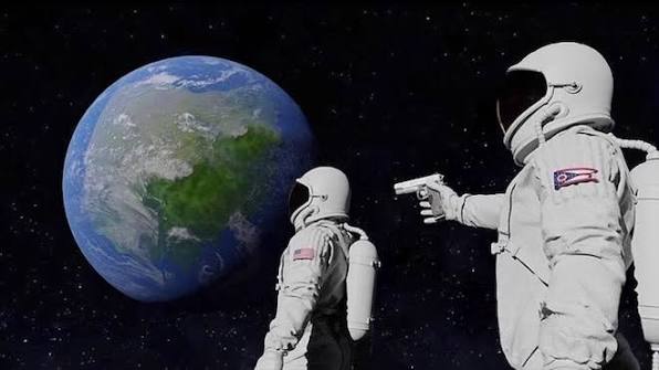 Two astronauts in spacesuits float against a starry backdrop with Earth visible, as one aims a pistol at the other, evoking a dramatic NFT artwork depicting an otherworldly confrontation. The image's surreal sci-fi tension complements the post's theme of NFTs, possibly suggesting a narrative piece in a digital collection.