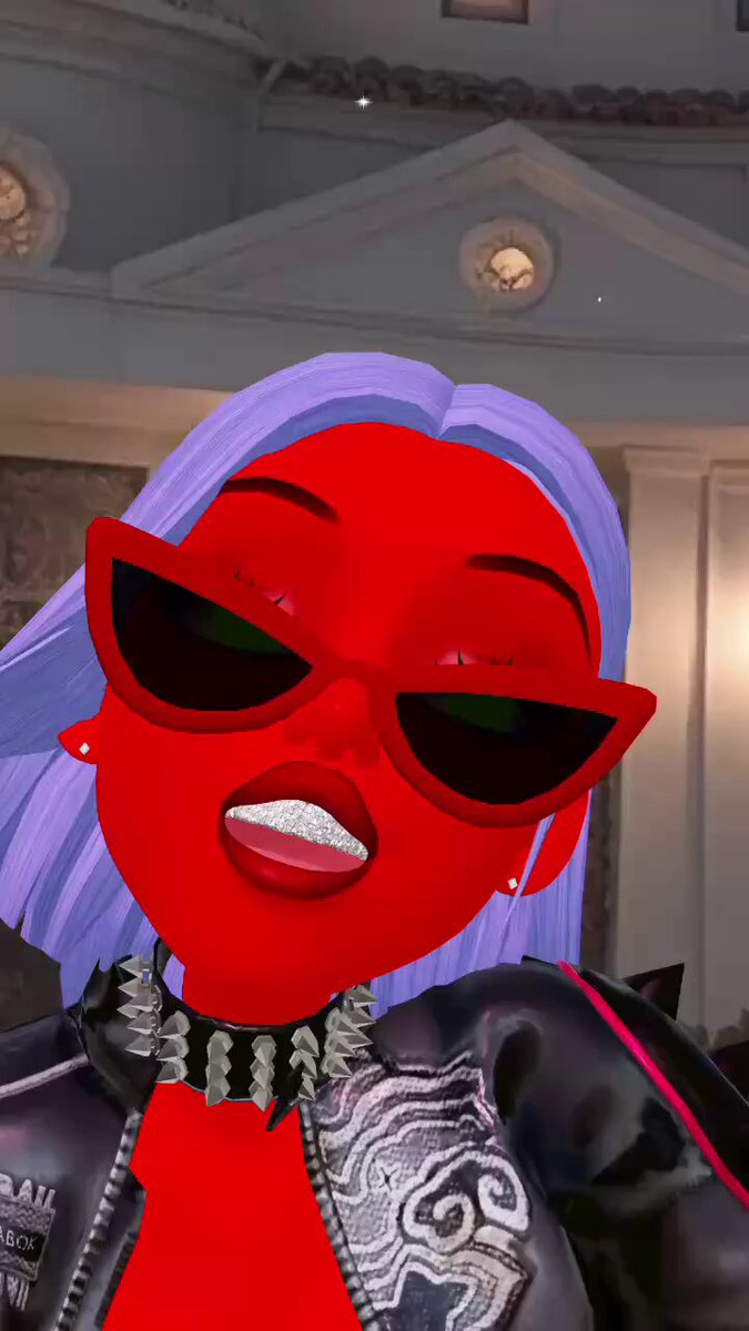 The image features a woman with purple hair wearing sunglasses, a red jacket or outfit, and a black leather jacket. She has her mouth open as if she's reading from a post or message. The caption reads "GFM!ITS FLAUNT FRIDAY! WHOS READY TO FLAUNT!? GRAB THOSE NFTS AND PUSHING THAT FLS IP! XANNY IS VIBEN TO “ROCK WIT ME" and "PUSHING THAT FLS IP!".