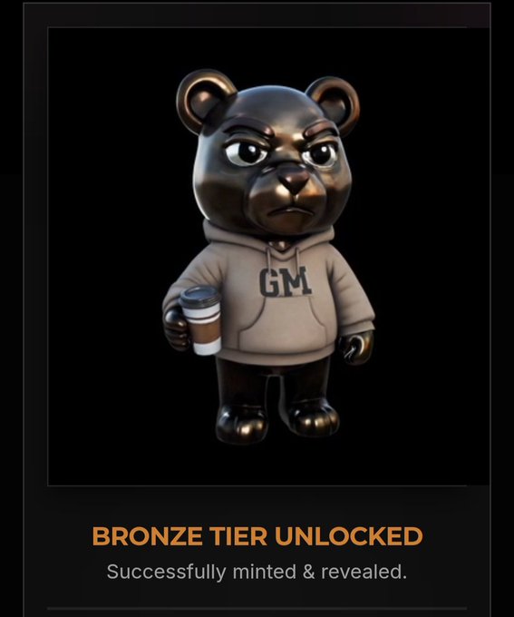 A bronze-colored bear figurine wearing a hoodie with 'GM' printed on it holds a coffee cup, with text reading 'BRONZE TIER UNLOCKED - Successfully minted & revealed.'