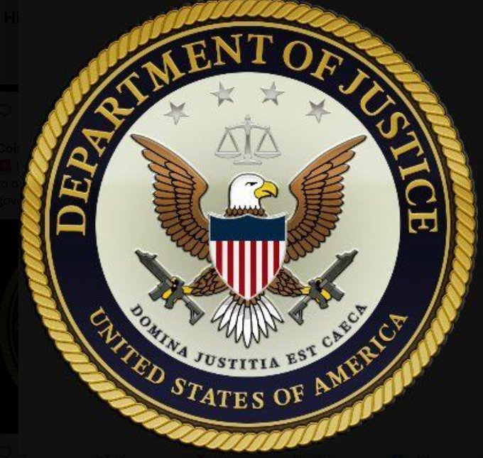 The official seal of the United States Department of Justice featuring an eagle, shield, scales of justice, and the motto 'DOMINA JUSTITIA EST CAECA'.