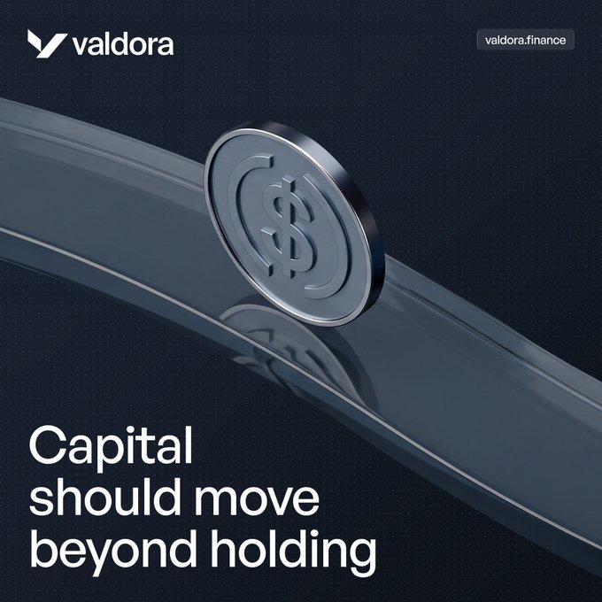 A dark blue advertisement for Valdora (valdora.finance) featuring a 3D metallic coin with a dollar sign sliding down a curved track, with the tagline 'Capital should move beyond holding'.