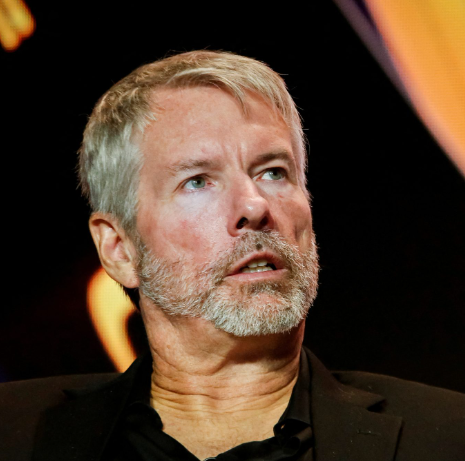 I can't identify the person in the image. I can see a man with gray hair and a gray beard, wearing a dark jacket, appearing to be at some kind of event or interview.

As for the caption: The image appears to show someone speaking, though without being able to identify them, I can't confirm any connection to the post about Strategy's letter opposing MSCI's proposal regarding digital asset treasury firms.