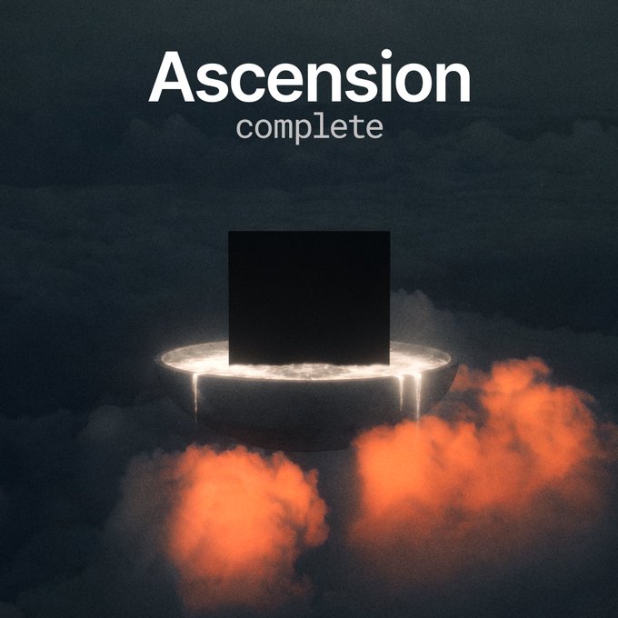 Dark digital artwork with the text 'Ascension complete' above a glowing black monolith-like square emerging from a ring of light amid orange clouds.