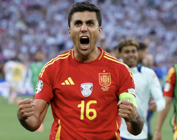 This image shows Rodri in a Spain jersey, celebrating a goal. The accompanying post highlights how a user named "tankjack" made $127,892 betting on the same Spain vs Belgium match via Polymarket.