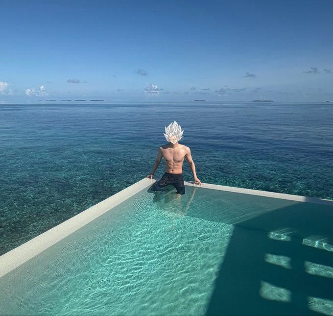 A muscular figure with spiky white anime-style hair stands at the edge of an infinity pool overlooking a vast blue ocean.