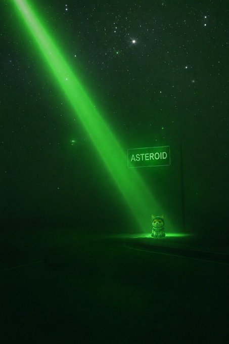 A small Dogecoin Shiba Inu figurine sits bathed in a glowing green laser beam cutting through a starry night sky, with a floating sign reading "ASTEROID" illuminating the scene above. The image visually represents the post's anticipation of a powerful awakening that will bring the $ASTEROID token into existence, symbolizing the dormant Doge awaiting its cosmic transformation.