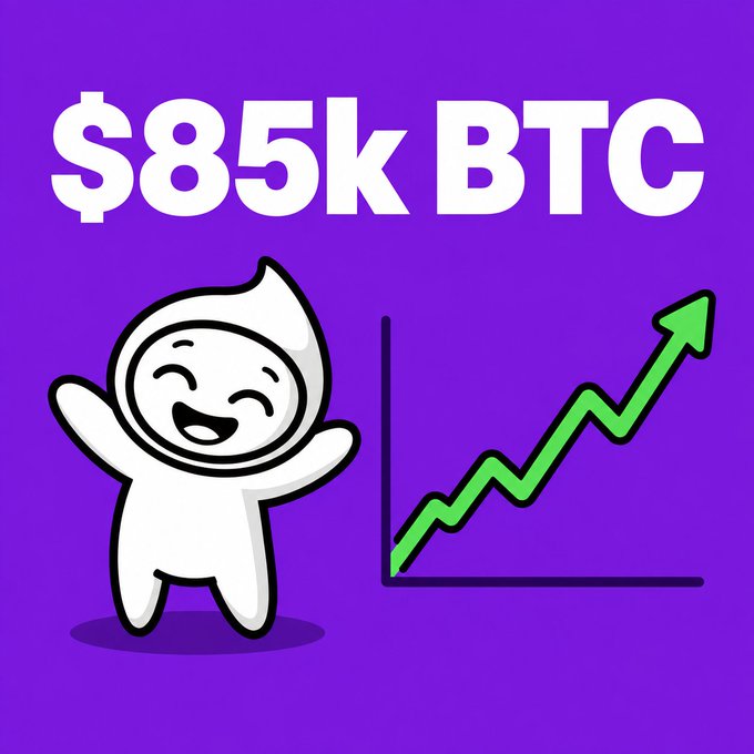 A purple graphic with bold white text reading '$85k BTC' featuring a smiling white cartoon character with arms raised alongside an upward-trending green arrow chart.