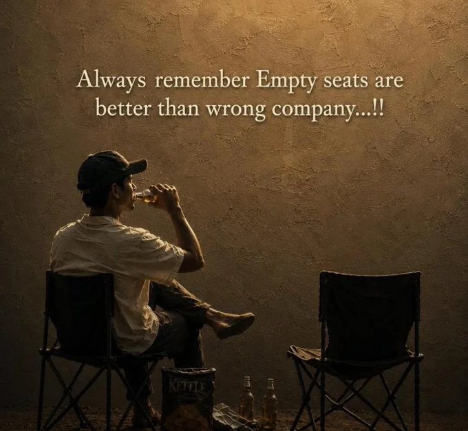 A moody image of a man drinking from a glass while sitting in a folding chair beside an empty chair, with text reading 'Always remember Empty seats are better than wrong company...!!'