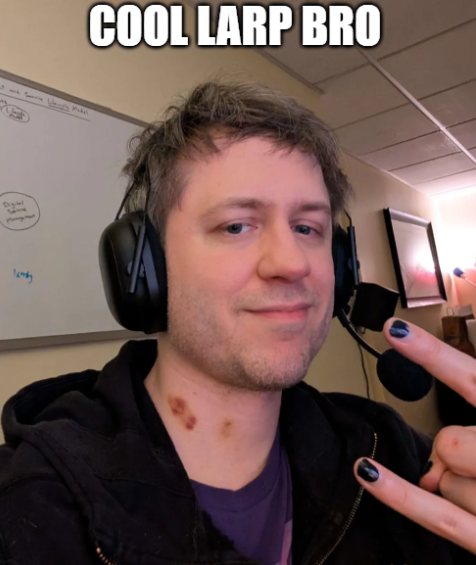 A selfie-style photo of a man wearing a headset with the text 'COOL LARP BRO' overlaid at the top.