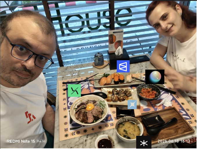 A man with glasses and a woman sit at a restaurant table filled with sushi, ramen, and other Japanese dishes, with the "REDMI Note 15 Pro 5G" watermark and date "2026.06.18" visible. The image humorously illustrates the post's message about chasing crypto airdrops—the couple appears to be taking a break from "missing" opportunities like Hyperliquid, Aster, Lighter, and Variational to enjoy a meal together.