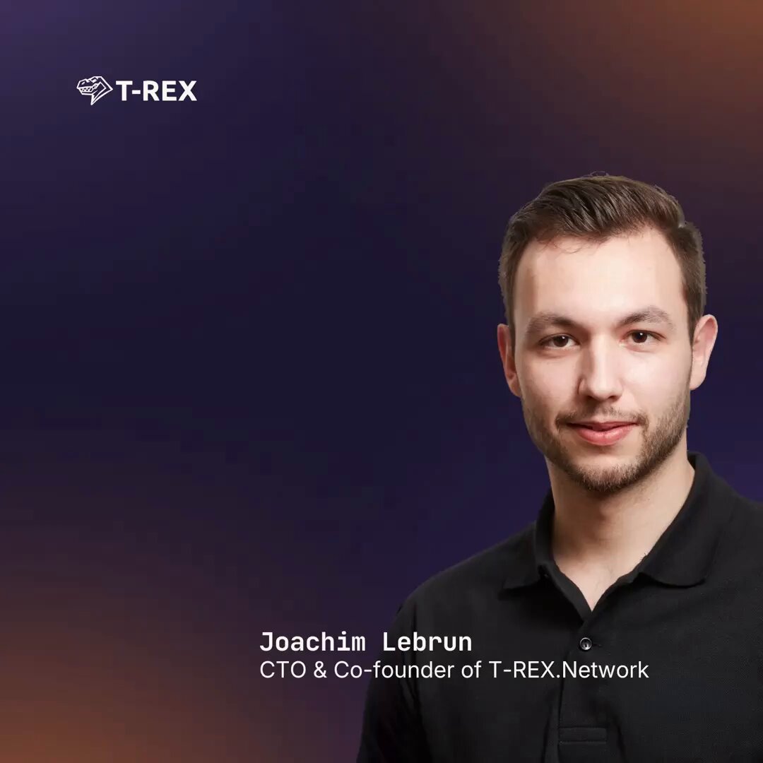 The image features a man wearing a black shirt, standing against a purple background with white text that reads "T-Rex" at the top of the image. The man appears to be smiling for the camera, possibly posing for a promotional or marketing campaign related to T-Rex. The image also includes some text that says "How do you keep compliance intact across 20 chains? Traditionally, reproducing identity validation on every chain, but this doesn't scale. One check on T-REX Ledger. Valid instantly across every chain." This suggests that the man might be promoting a new software or platform developed by T-Rex Network, which could potentially help businesses manage compliance and data security across multiple chains more efficiently.