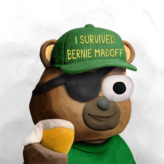 A teddy bear plush toy with a pirate eye patch holds a foam finger while wearing a green hat reading "I SURVIVED BERNIE MADOFF." The image humorously mocks investors who panic-sold crypto holdings, comparing them to Madoff scheme victims, with the bear's smug expression symbolizing those who held through the volatile night.