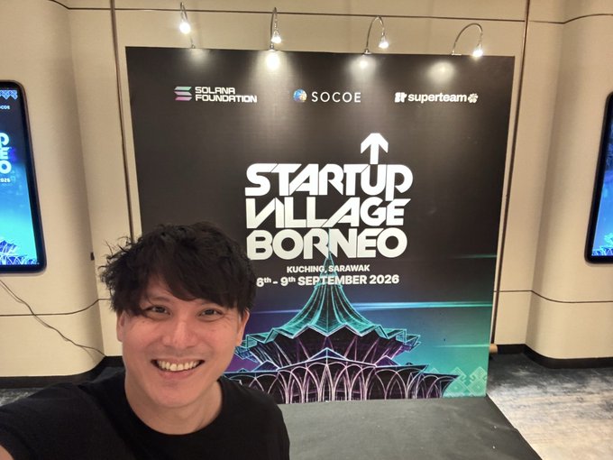 A man poses in front of a 'Startup Village Borneo' banner at the Solana Foundation event in Kuching, Sarawak, dated 6th-9th September 2026.