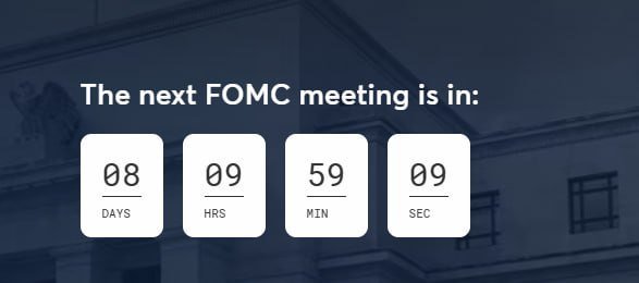 A countdown timer showing 'The next FOMC meeting is in: 08 DAYS 09 HRS 59 MIN 09 SEC' displayed over an image of the Federal Reserve building.