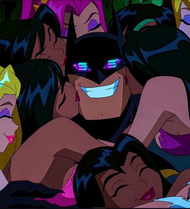 An animated still showing a smiling masked character with glowing purple eyes (resembling a Batman-style hero) surrounded by other characters in a stylized, colorful art style.