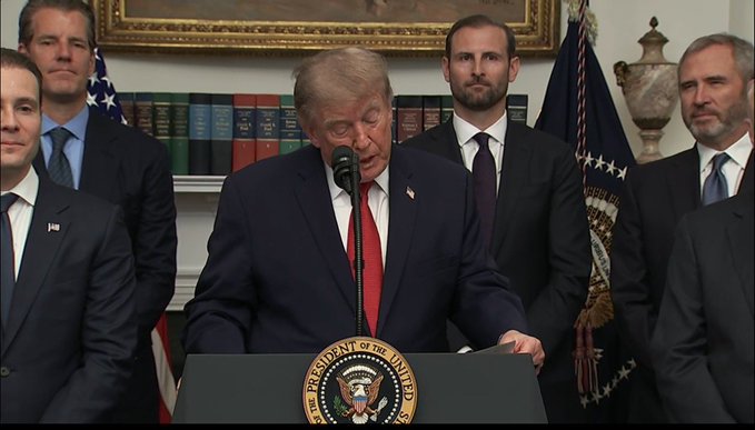 Donald Trump speaks at a podium with the Presidential Seal, accompanied by several men in suits. The post "It’s always been XRP I wish you’d wake up." suggests a message about cryptocurrency or financial markets, perhaps implying that the financial situation or a particular investment (XRP) is being overlooked or misunderstood in the context of the image.