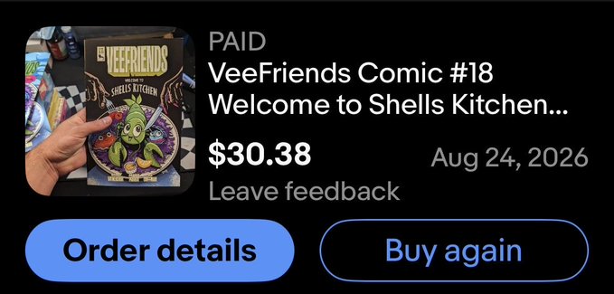 A screenshot of a completed online order for a 'VeeFriends Comic #18 Welcome to Shells Kitchen...' marked as PAID at $30.38 on Aug 24, 2026, with buttons to view order details or buy again.