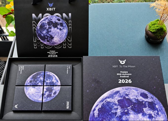 An XBIT gift box set featuring a 'MOON' themed design with 'Happy Mid-Autumn Festival 2026' text, showing a purple moon graphic divided into four puzzle-like sections on a dark starry background.
