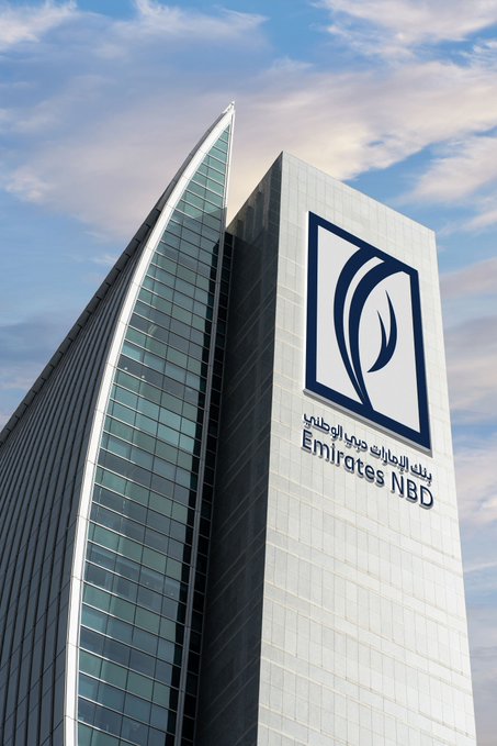 The Emirates NBD skyscraper towers against a blue sky, its facade prominently displaying the bank's logo and name in both English and Arabic, aligning with the announcement of the bank becoming the first regional institution to launch real-time cross-border payments on the Partior blockchain-based network.