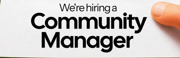 White recruitment banner with black text announcing 'We're hiring a Community Manager' with a finger pointing from the right side.