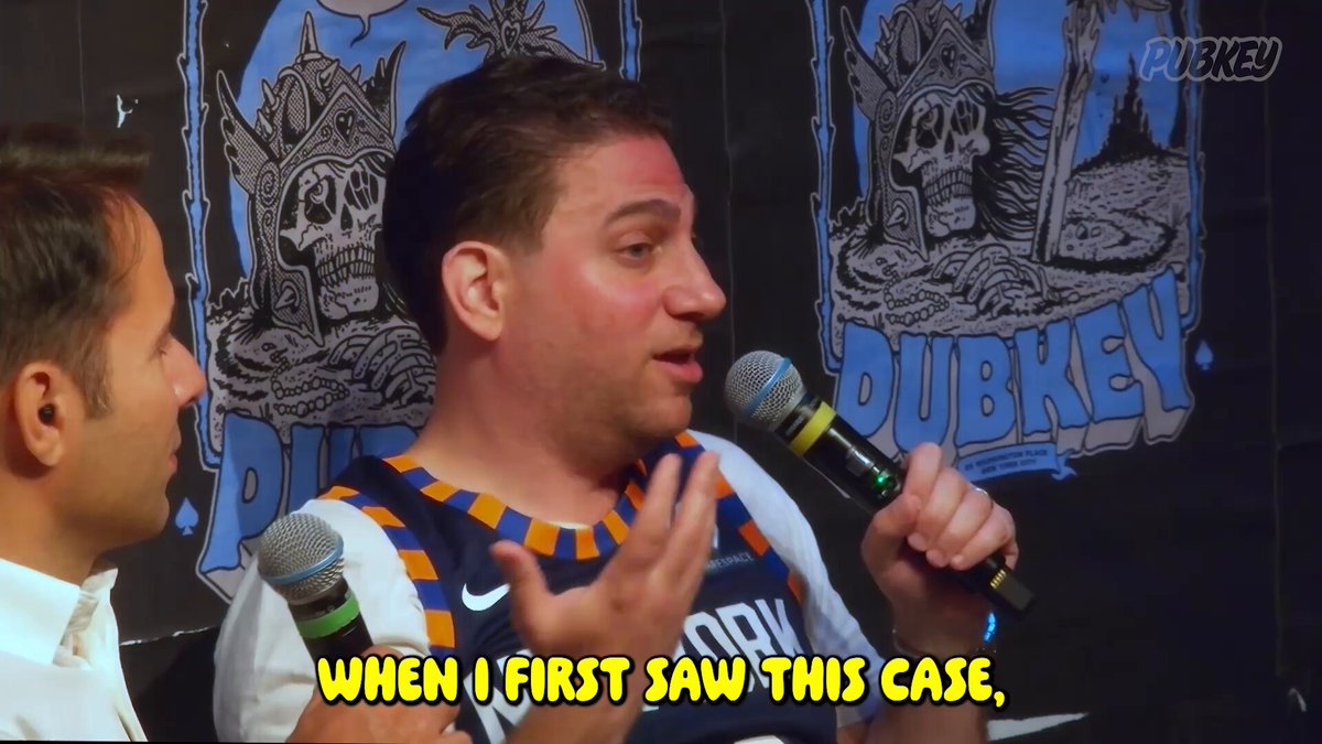 The image shows a man wearing a basketball jersey holding a microphone at an event with another person standing next to him. The background features a blue wall with two logos - one of which reads "PUBKEY" and the other "NYC". There is also text in the image that says "When I first saw this case, someone is trying to claim 3.8 million dormant Bitcoin as theirs. We sat down with Ian Cohen ( @btclawyerguy ) to explain the situation."