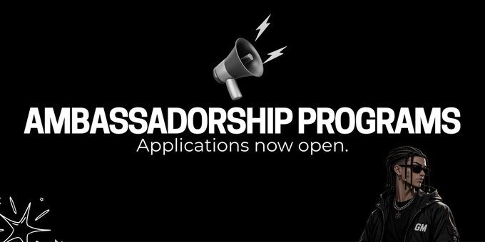 A promotional graphic featuring a megaphone icon and the bold text "AMBASSADORSHIP PROGRAMS" with "Applications now open" beneath it, alongside an illustrated figure wearing sunglasses and a jacket marked "GM," visually supporting a post announcing seven newly launched Web3 ambassador roles offering $50–$300 weekly payments in USDT/USDC.