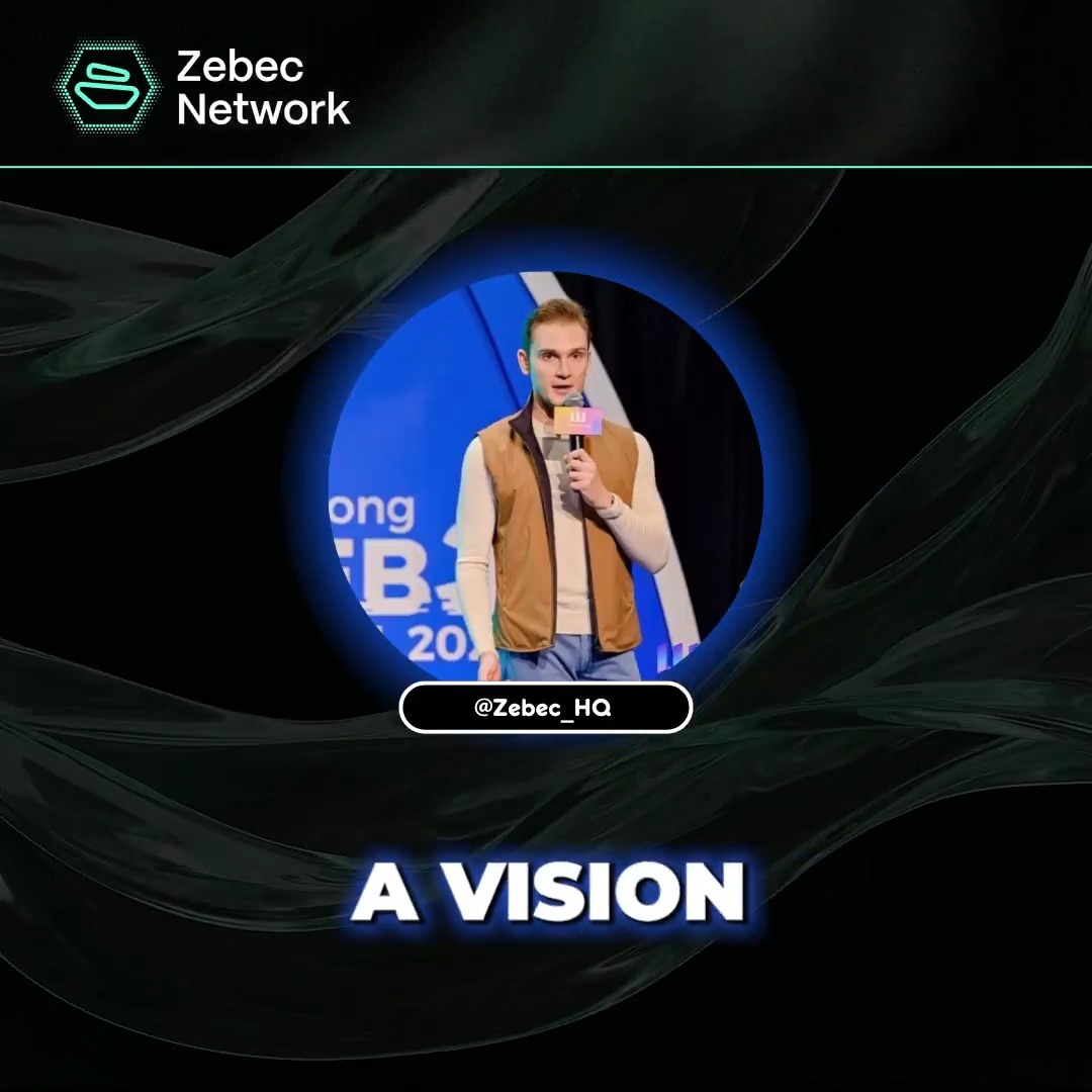 The image features a man standing next to a microphone, holding it up as if he's speaking at an event or giving a presentation. The background of the image is black with blue waves, creating a visually striking contrast that draws attention to the speaker. The text in the image reads "What makes Zebec different? @simonb_ldn discusses Zebec’s vision for a comprehensive payment network bridging blockchains, businesses and borders." This suggests that the man is discussing or promoting an idea related to blockchain technology and its potential impact on various aspects of society.
