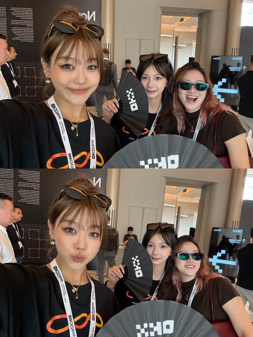 Two selfie-style photos show three young women at an event, wearing lanyards and holding dark fans displaying Korean text, with one woman in green-tinted sunglasses.