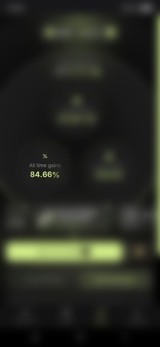A blurred screen with a highlighted circular graphic displaying a '%' symbol, 'All time gains', and the value '84.66%' in yellow text.