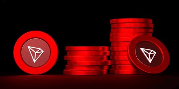 Red-tinted 3D rendering of stacked Tron (TRX) cryptocurrency coins against a dark background.