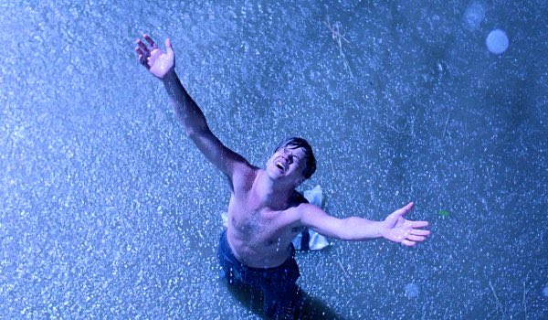 The image shows a shirtless man standing in water, with his arms raised up as if he's embracing or celebrating something. The surrounding environment appears to be a beach setting, which adds to the overall atmosphere of joy and freedom. The caption provided seems unrelated to the main subject matter but could possibly be an attempt to create a connection between the image and the post about NEET dollars.

The man in the water is wearing blue jeans, adding a unique touch to the scene. The image captures a moment where the man's arms are raised high, conveying a sense of triumph or celebration over his circumstances.
