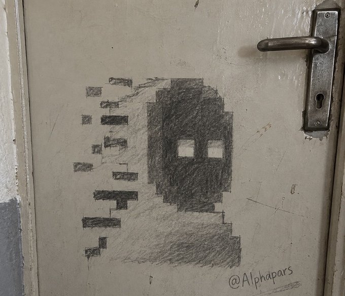 A pencil drawing on a white door shows a pixelated, glitching face next to the artist signature "@Alphapars," with a metal door handle visible on the right.