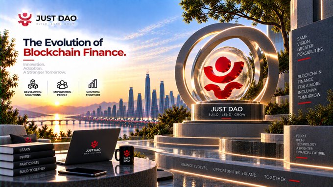 A JUST DAO promotional banner titled 'The Evolution of Blockchain Finance' featuring a futuristic cityscape, a golden trophy statue, and a laptop with the JUST DAO logo.
