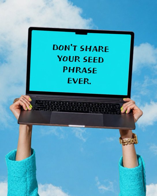 A person holds up a laptop against a blue cloudy sky, with the screen displaying "DON'T SHARE YOUR SEED PHRASE EVER." The image humorously reinforces the post's warning about protecting crypto seed phrases before stepping away from the digital world to "touch grass."