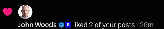 An Instagram-style notification showing a pink heart, a profile picture of an older man, and text 'John Woods liked 2 of your posts · 26m'.