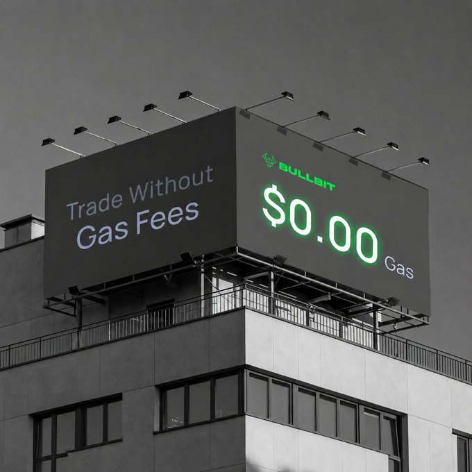 A billboard atop a building advertising 'BULLBIT' crypto platform with the slogan 'Trade Without Gas Fees' and '$0.00 Gas' in glowing green text.