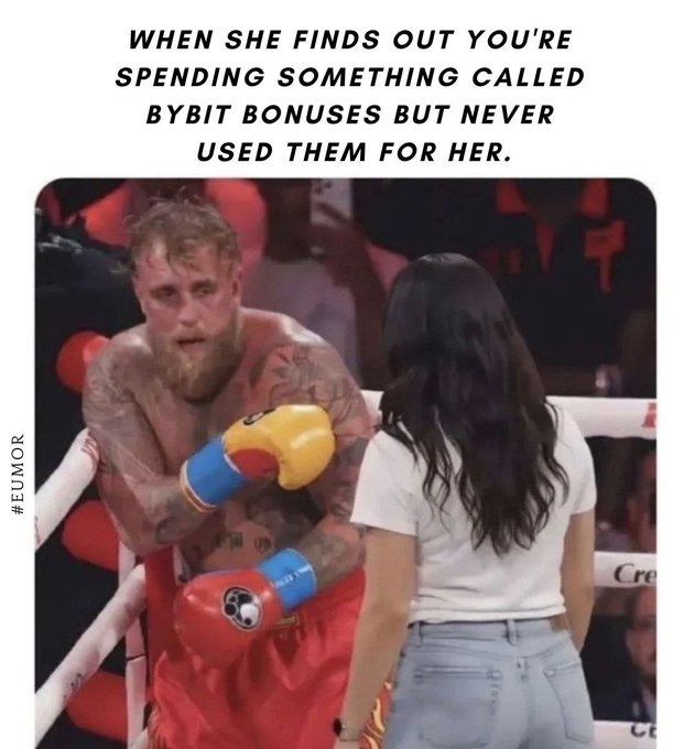 The image is a meme featuring Jake Paul in a boxing ring appearing wary/defensive of a woman whose back is to the camera, with the caption "WHEN SHE FINDS OUT YOU'RE SPENDING SOMETHING CALLED BYBIT BONUSES BUT NEVER USED THEM FOR HER." It humorously ties to the @BybitEU post by poking fun at crypto traders using ByBit bonuses for trading instead of gifts for their partners.