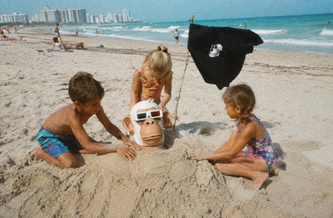 The image features a group of children playing with a monkey head, which appears to be made out of sand or clay. There are three kids in the scene - two sitting on the beach next to each other, while another child stands nearby. The monkey head is positioned between them and the ocean, creating an interesting focal point for their playtime.

The post that accompanies this image reads: "GM locked in bored ape yacht club". This phrase seems unrelated to the children's activities at first glance but could be a reference to a popular children's book or movie featuring a monkey character. The connection between the image and the post might not be immediately apparent, but it could be an interesting coincidence that adds context to the scene.