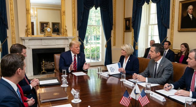 A meeting takes place in the Oval Office at the White House, where President Trump is seated at a table engaged in discussion with several individuals, including senators, who appear to be reviewing documents related to the Crypto Clarity Act.

The image relates to the post as it depicts the setting of the scheduled meeting on July 16, where President Trump is convening with Republican Senators, including Lummis and Moreno, to discuss the promotion of the Crypto Clarity Act and ethical concerns in the cryptocurrency industry.