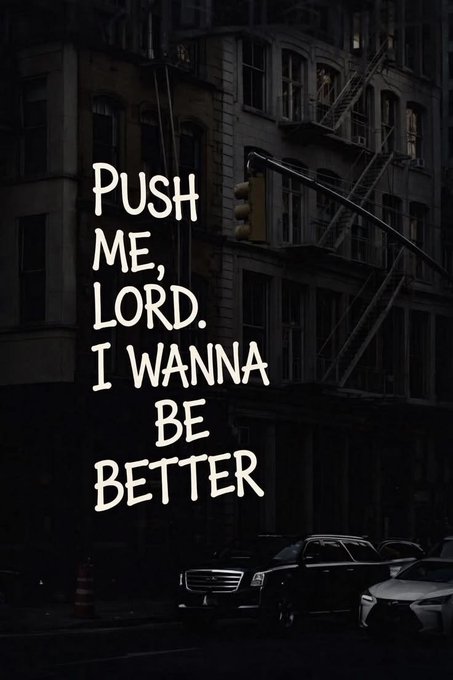 A dark, moody image of a city street with traffic lights and a fire escape, overlaid with the bold white text: 'PUSH ME, LORD. I WANNA BE BETTER'.