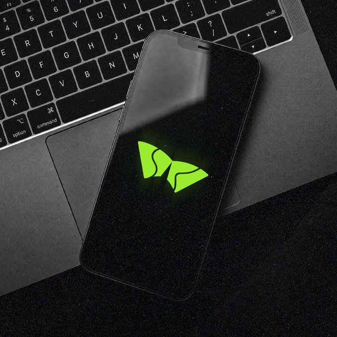 A smartphone displaying the SK Hynix logo sits on a laptop keyboard, visually representing the semiconductor giant's entry into the stock market facilitated by OKX Wallet. This image aligns with the post's announcement of SK Hynix's Nasdaq debut and OKX Wallet's role in direct on-chain delivery of real shares.